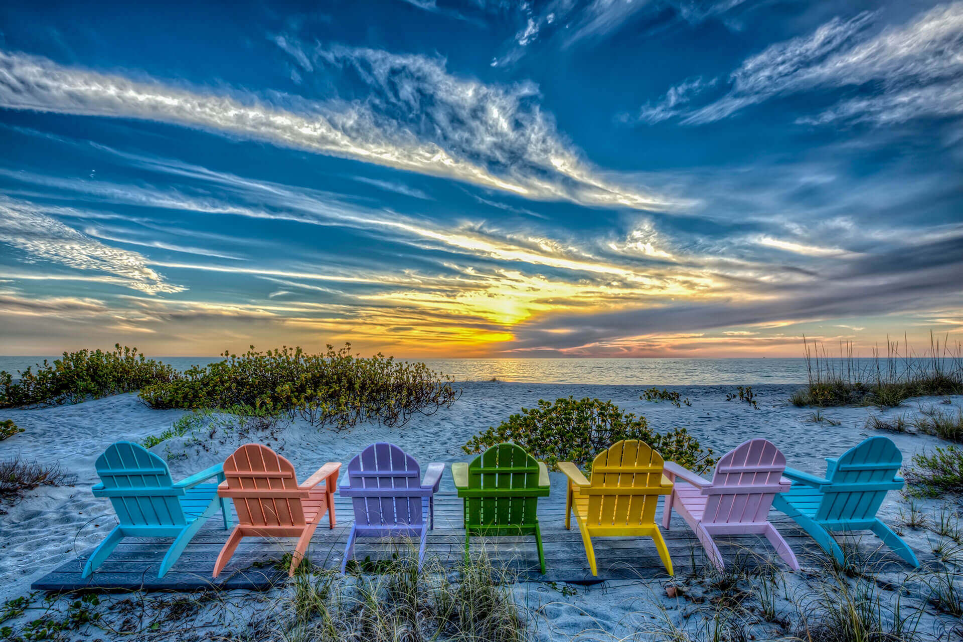 Six chairs on the beach